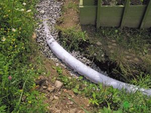 A Picture of a French Drain Installation Going Horizontally